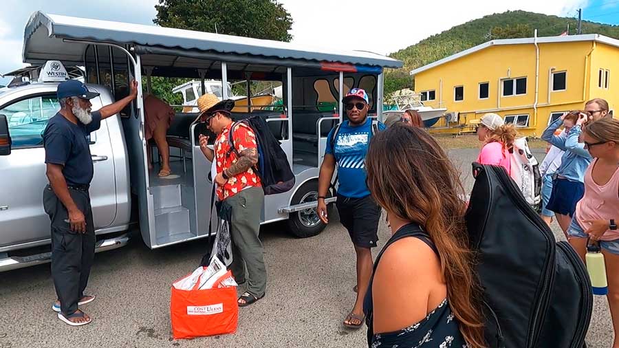 People unloading their things on the Safari taxi