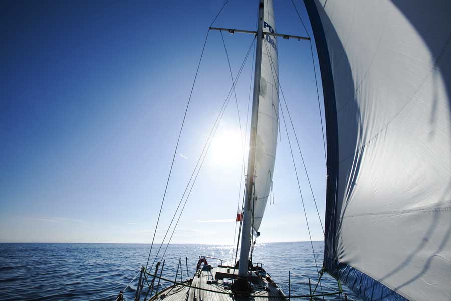 View of a sailing boat and the clear blue sky during a sunny day