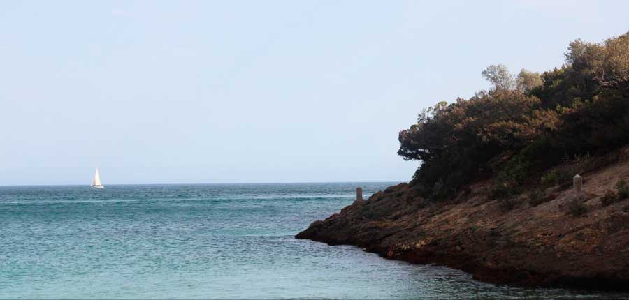 A sailing boat from afar om the water of Portugal
