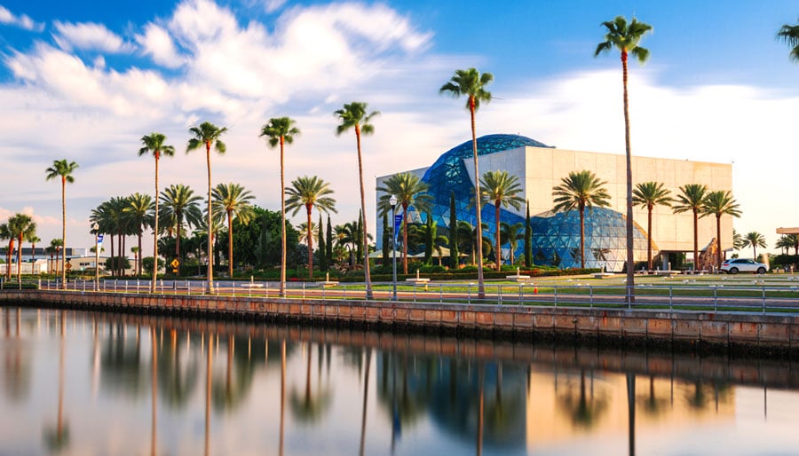 View of The Dali Museum and a line of palm trees across it