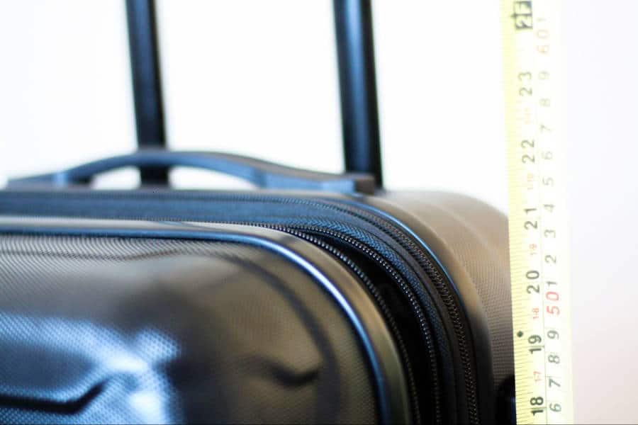A tape measure on the side of the handle of Samsonite Omni