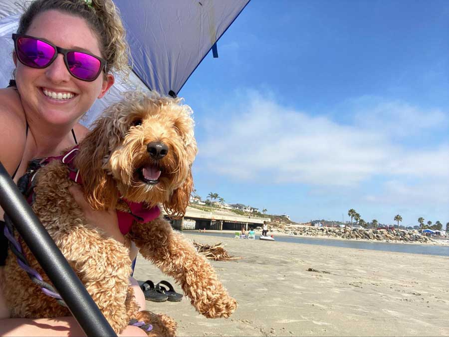 The author with her dog enjoying their day in San Elijo State Beach