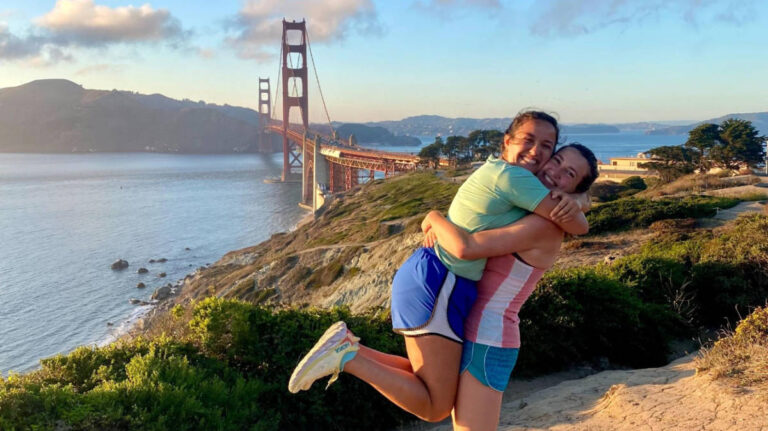 The author, Laura McFarland with her partner and the Golden Gate Bridge on their background