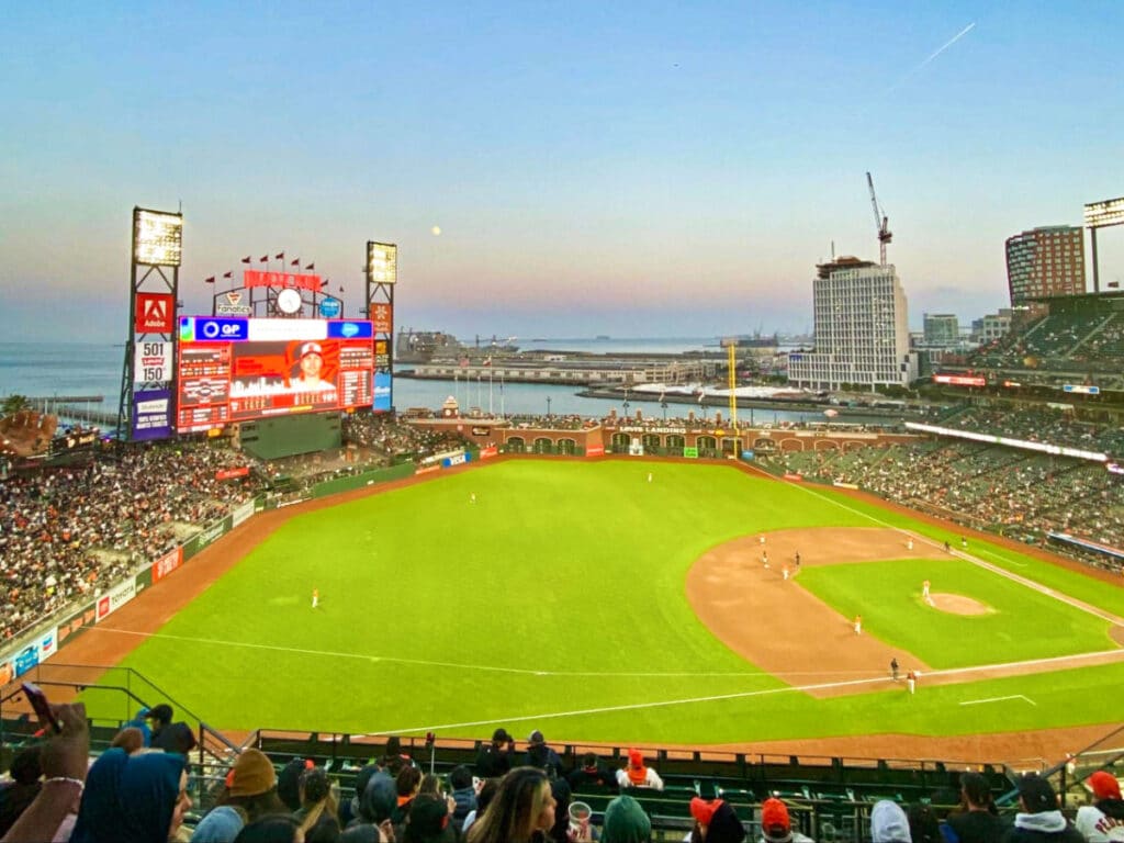 View of the crowd watching a game at the San Francisco Giants baseball park with the McCovey Cove in the background