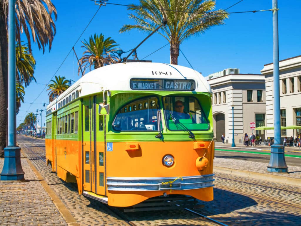 A colorful cable car in the street of San Francisco