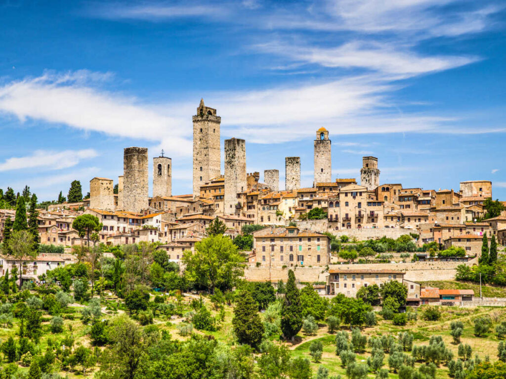 Panoramic view of the medieval town of San Gimignano surrounded by greenery