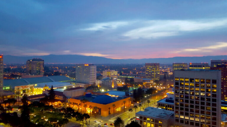 Aerial view of San Jose, Silicon Valley the Tech Museum, McEnery Convention Center, Silicon Valley, and the Santa Cruz Mountains at sunset