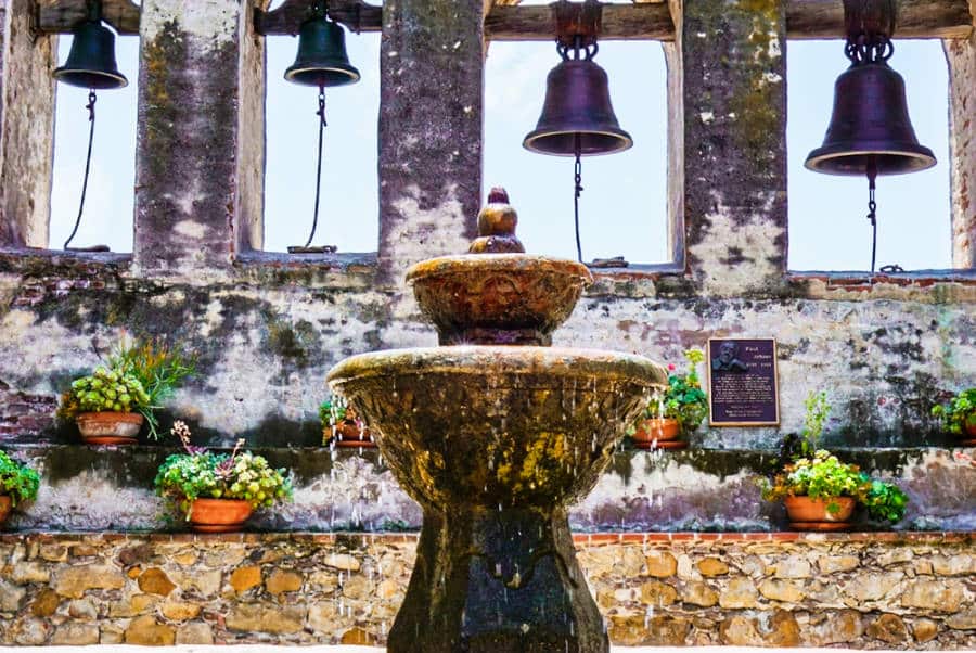 View of the fountain in front of the set of bells in San Juan Capistrano
