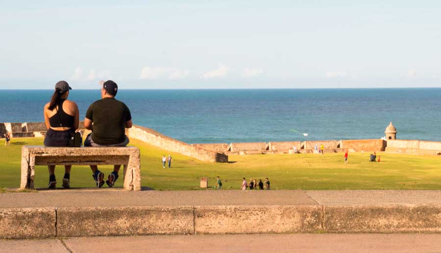 A couple enjoying the scenic view from the bench