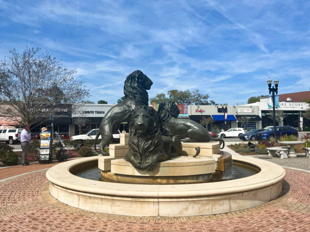 The San Marco lion sculptures in the center of the fountain