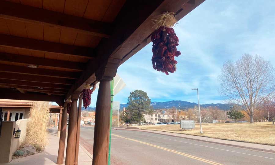 Dries chilies hanging over a building in Santa Fe
