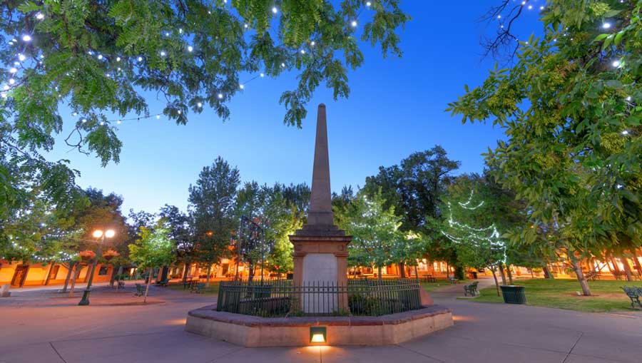 Clear blue sky over the Sante Fe Plaza at dusk