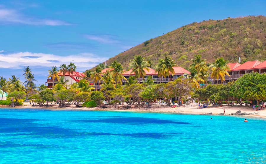 View of the Sapphire Beach Resort from afar and the blue water on the beach