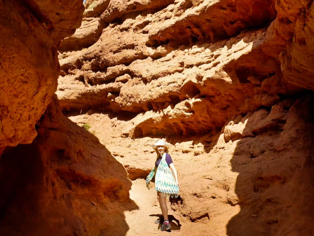 The author Sarah Heath posing for a photo at the bottom of the canyon in Pingshan Lake Grand Canyon