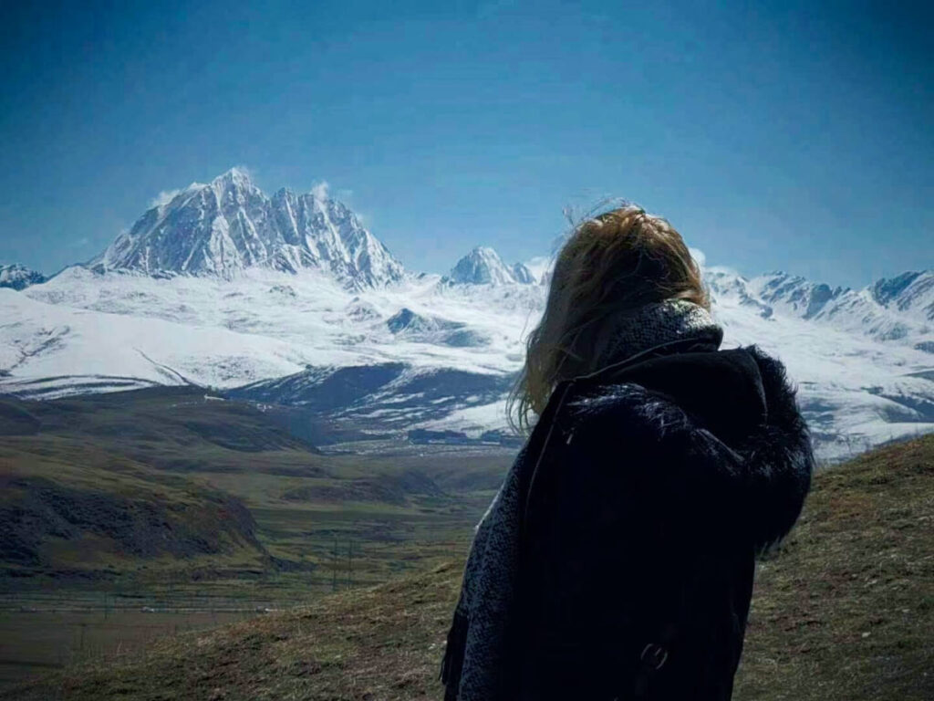 The author Sarah Heath admiring the Yala Snow Mountain
