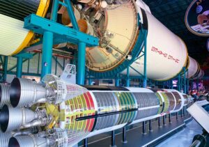 A scaled model of the Saturn V rocket displayed for viewing