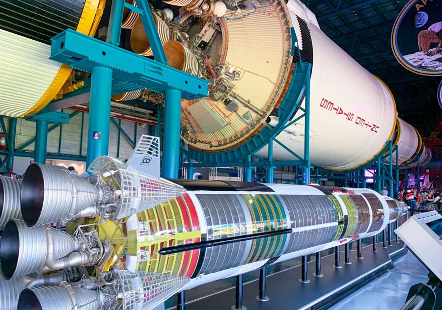 A scaled model of the Saturn V rocket displayed for viewing