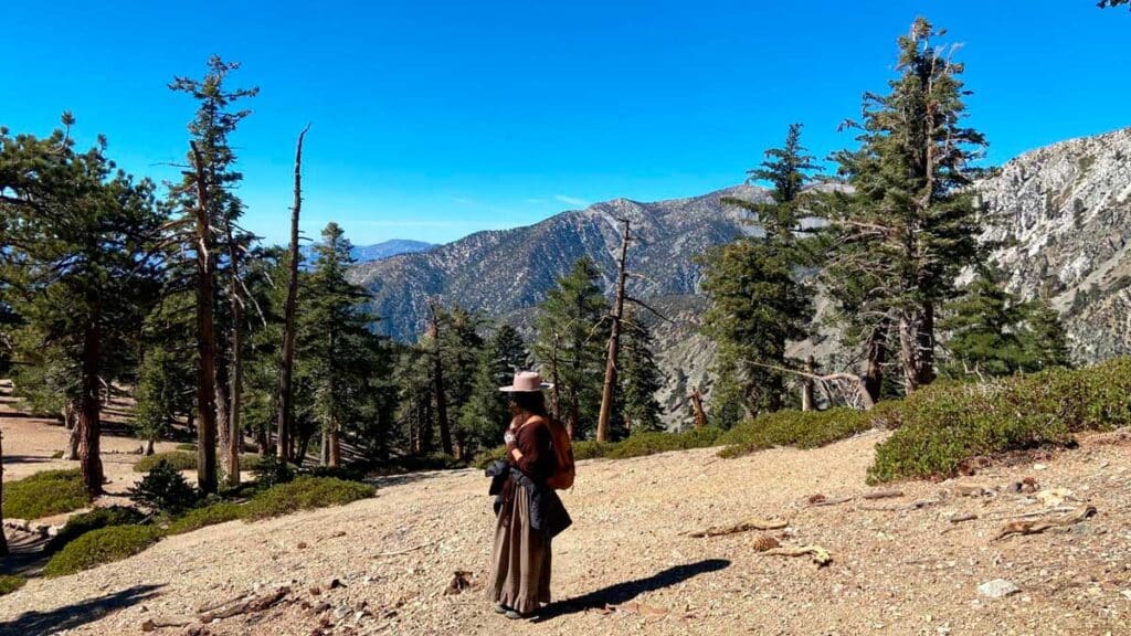 The author posing for a photo under the clear blue sky in California