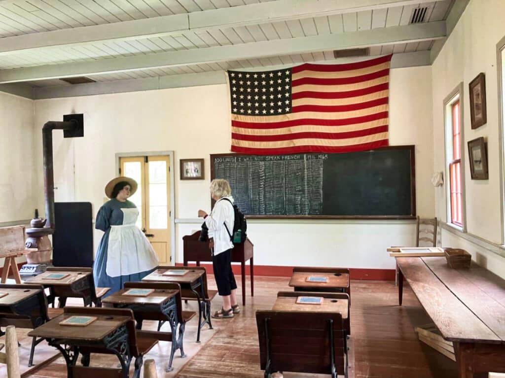 View of the people inside a schoolhouse in the Vermilionville Museum