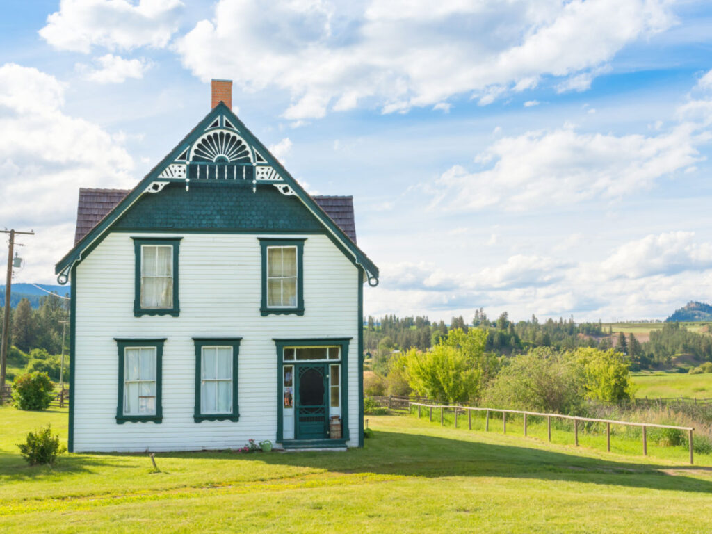 Vernon's Schubert House: A white house adorned with green trim