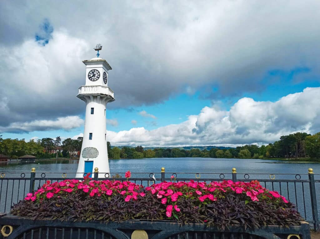 View of the Scott Memorial Lighthouse surrounded by blooming flowers