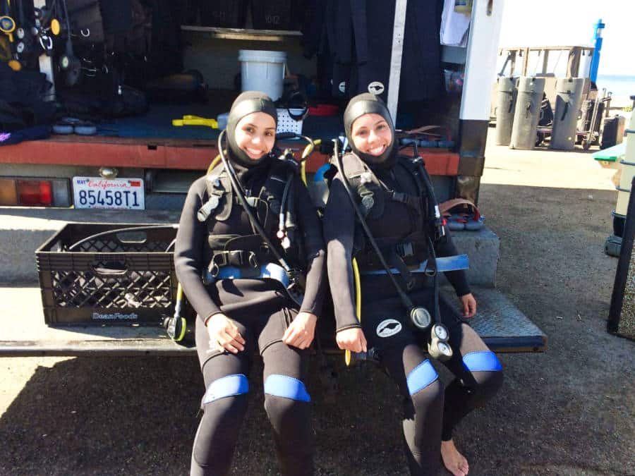 The author McKenna Mobley and her sister in scuba dive suits