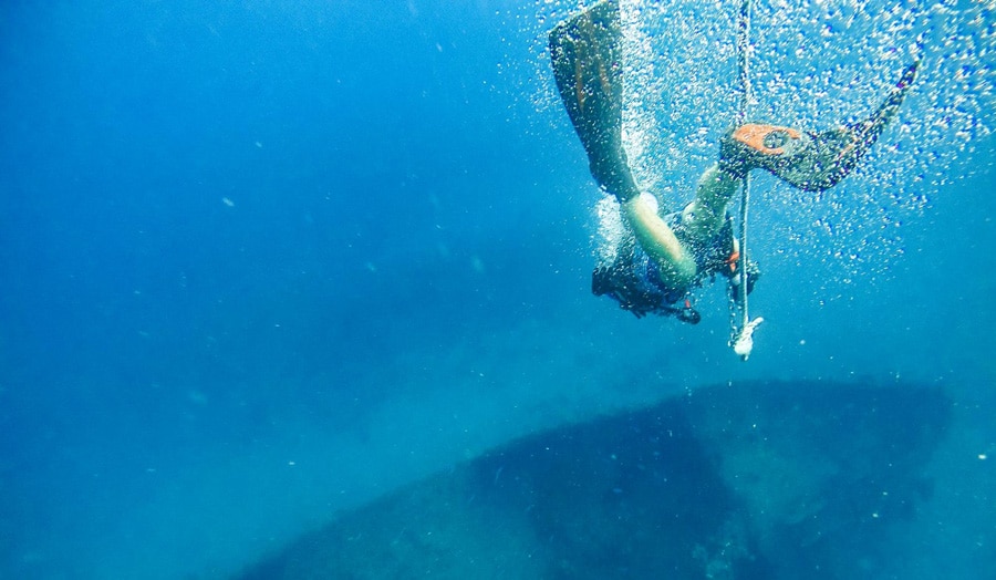 View of a scuba diver and the underwater view of Fort Lauderdale