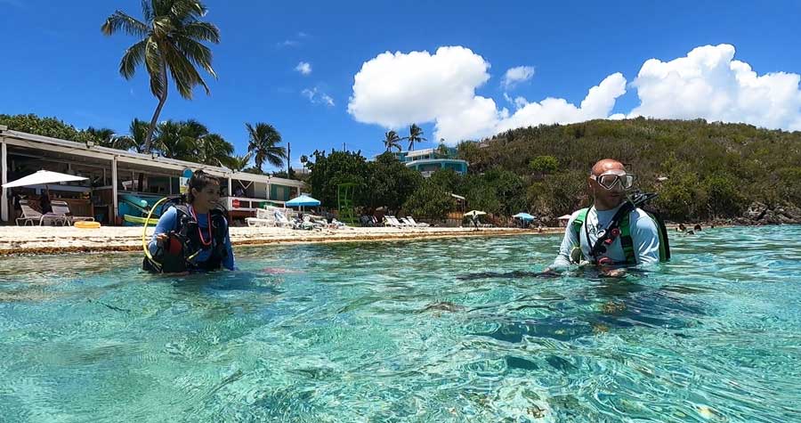 People wearing their scuba diving gear at Coki Beach