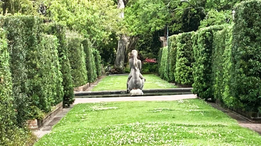 A sculpture surrounded with greenery at The New Orleans Botanical Garden