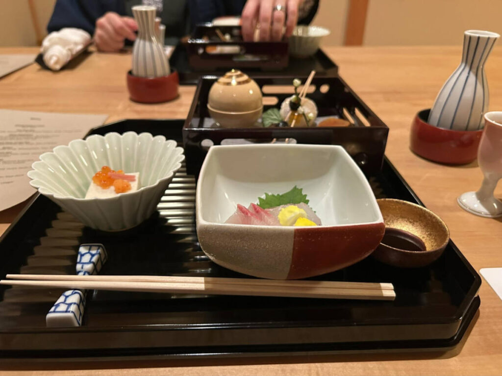 Sea urchin with salmon roe and fresh sashimi served on the Ryokan