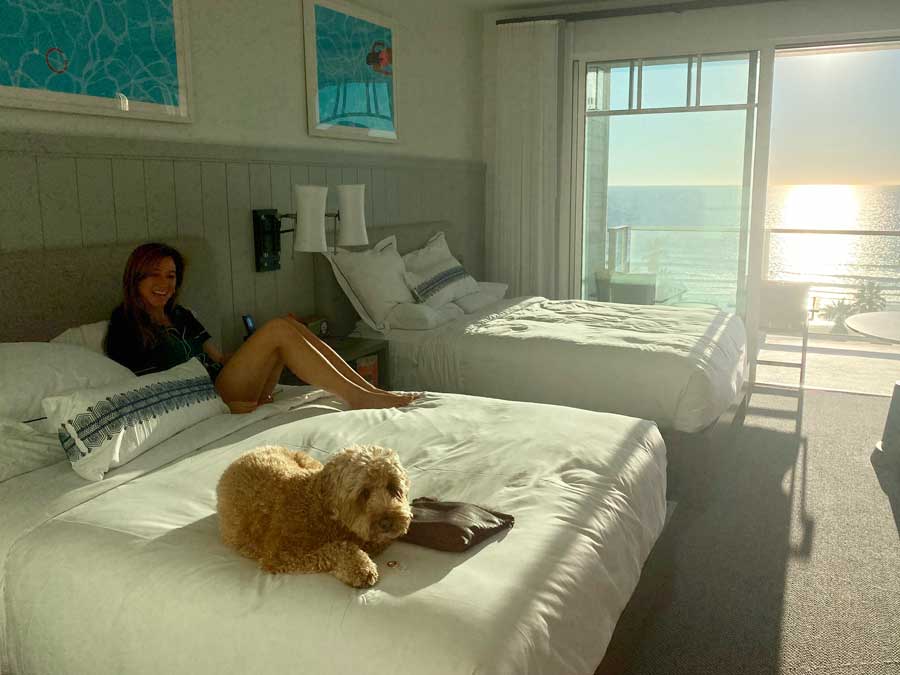 A woman and a dog posing for a picture in Seabird Resort