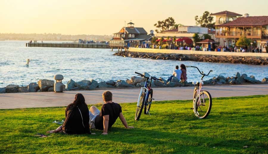 People relaxing at the San Diego’s Seaport Village during sunset