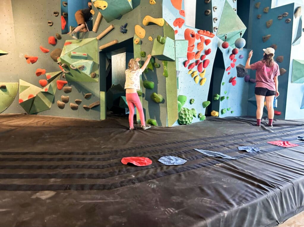 A kid preparing to climb the wall in Seattle Bouldering Project