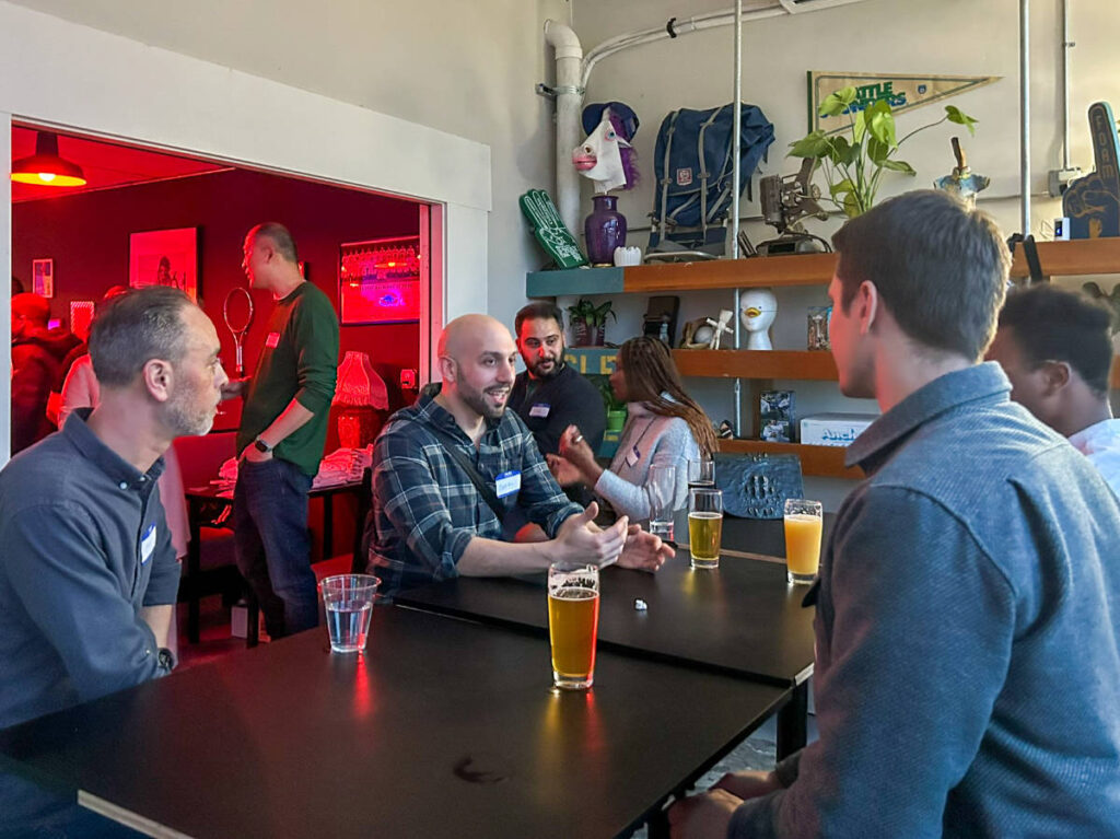 People smiling for a photo during the Travel Lemming's Seattle Community Meetups