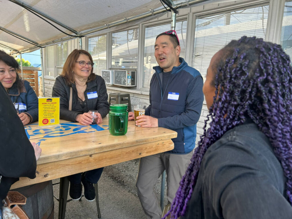 People sharing stories during the Travel Lemming's Seattle Community Meetups