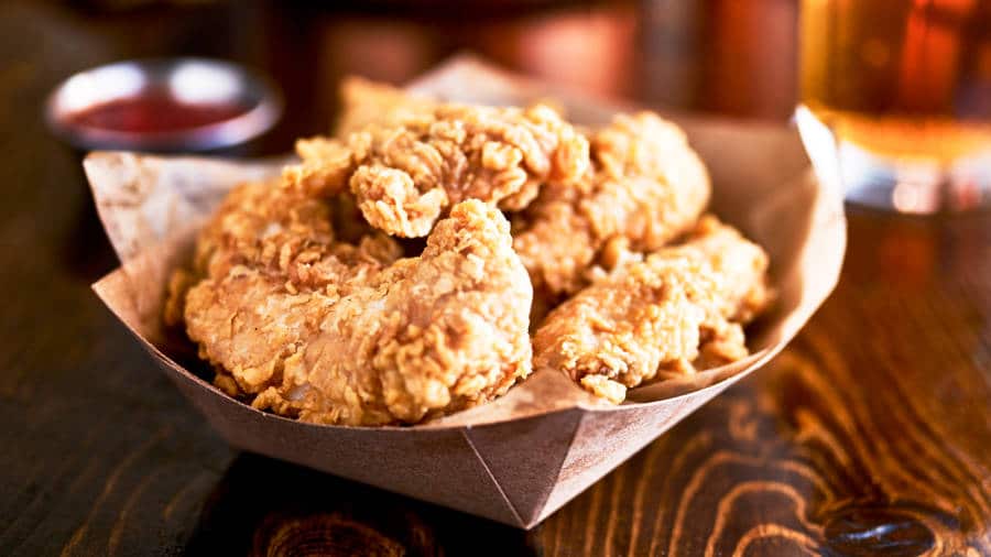 Closeup view of a basket of fried chicken tenders