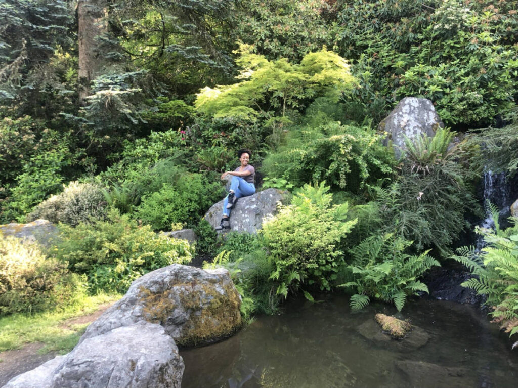 The author, Chelsea Booker posing for a photo at the Seattle’s Kubota Gardens