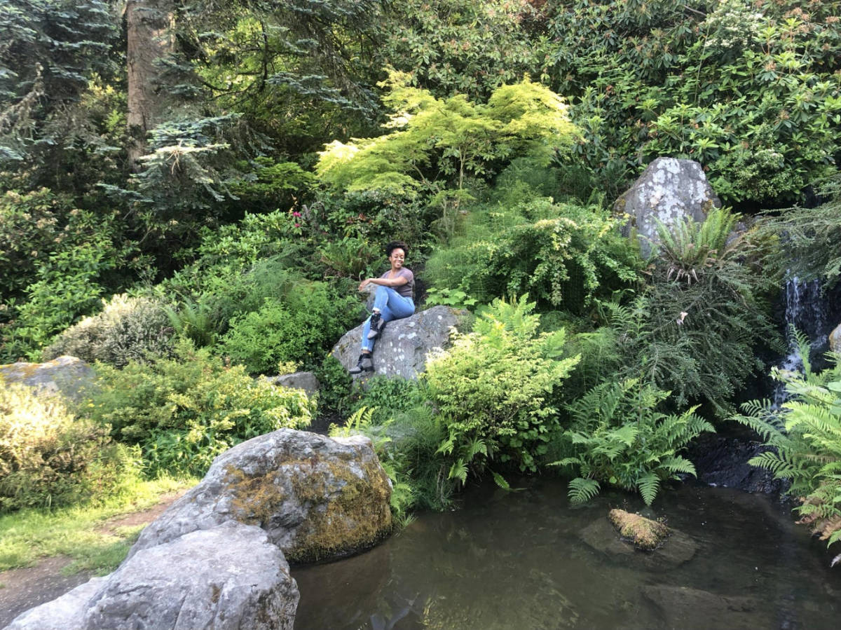 The author, Chelsea Booker posing for a photo at the Seattle’s Kubota Gardens
