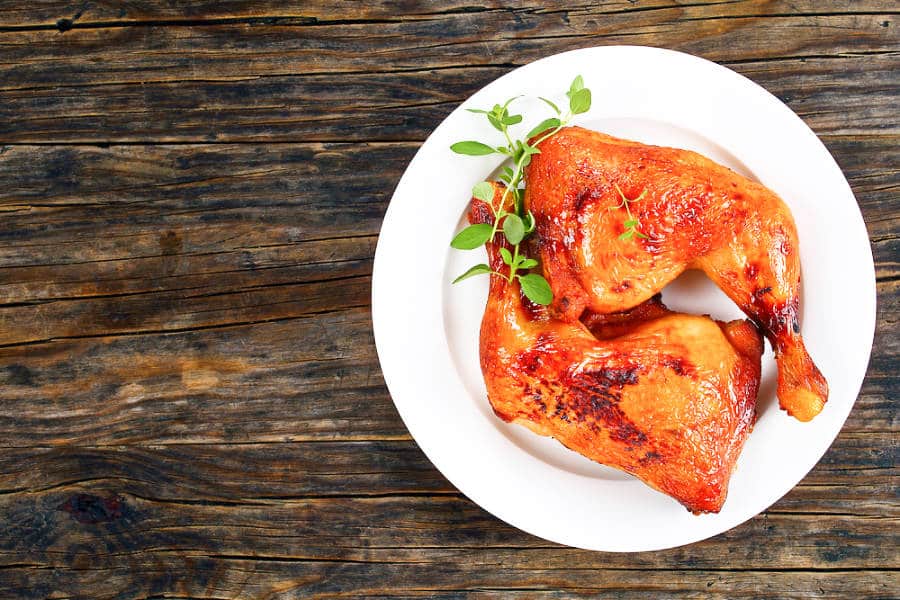 A plate of roasted chicken legs