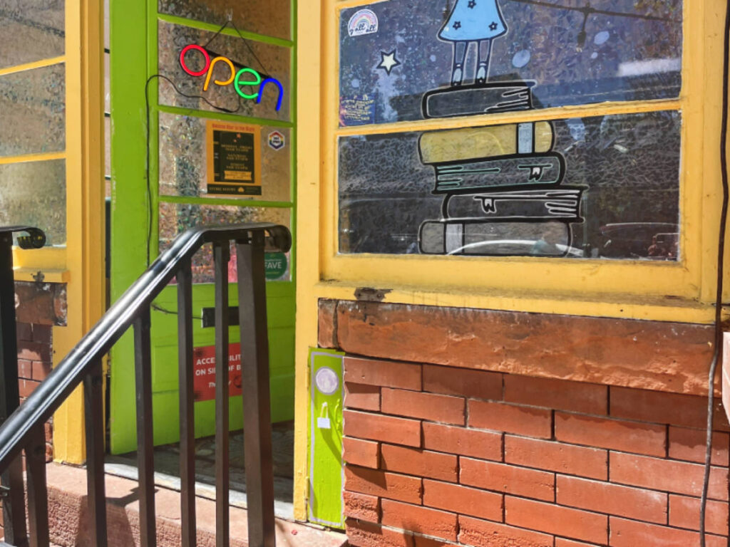 A tiny door beside the big-person door at Second Star to the Right bookstore