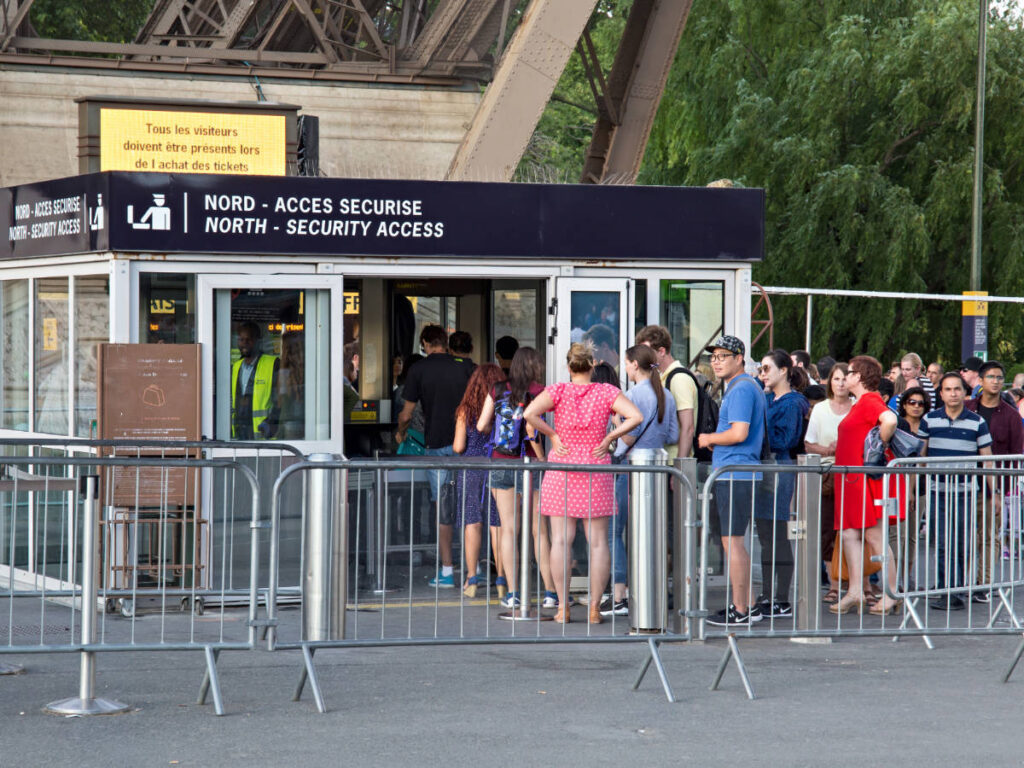 A line of people at the security checkpoints in Eiffel Tower