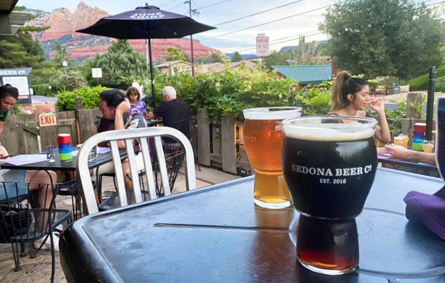 Two glasses of different beers served at the outdoor seating area at Sedona Beer Co.