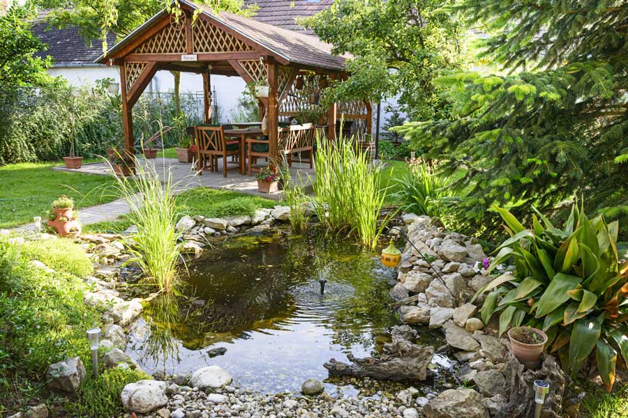 A garden with a small pond in Self Realization Fellowship Encinitas Temple
