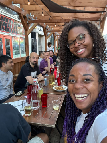 Travel Lemming editor, Chelsea Booker smiling for a photo with some of the people who attended the recent Seattle Travel Community Meetup