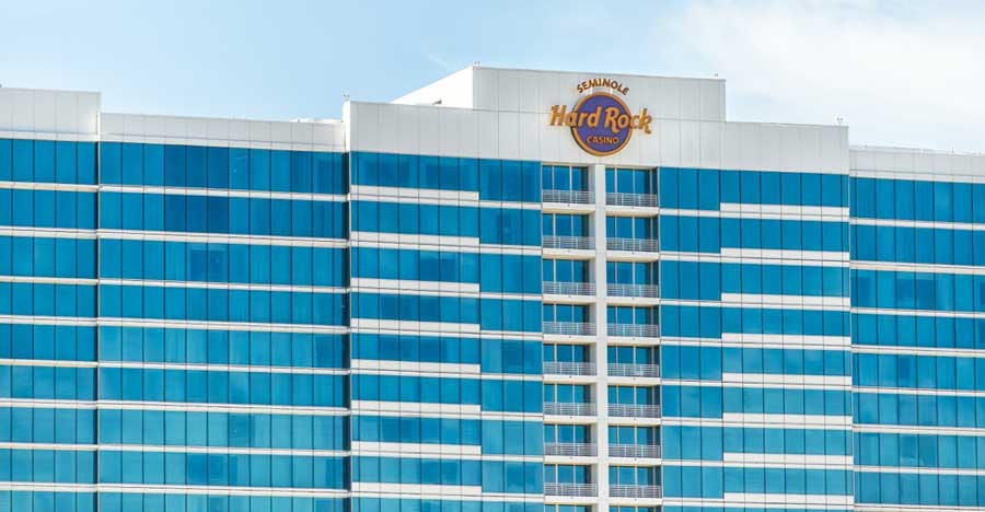 A modern glass building exterior of Seminole Hard Rock Hotel and Casino