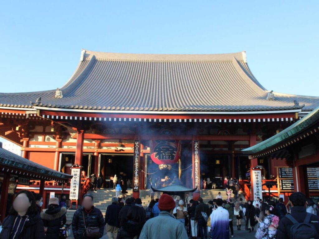 People visiting Senso-Ji Temple in the late afternoon