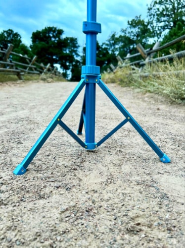 Closeup look of the legs of Sensyne 62'' Phone Tripod on uneven terrain