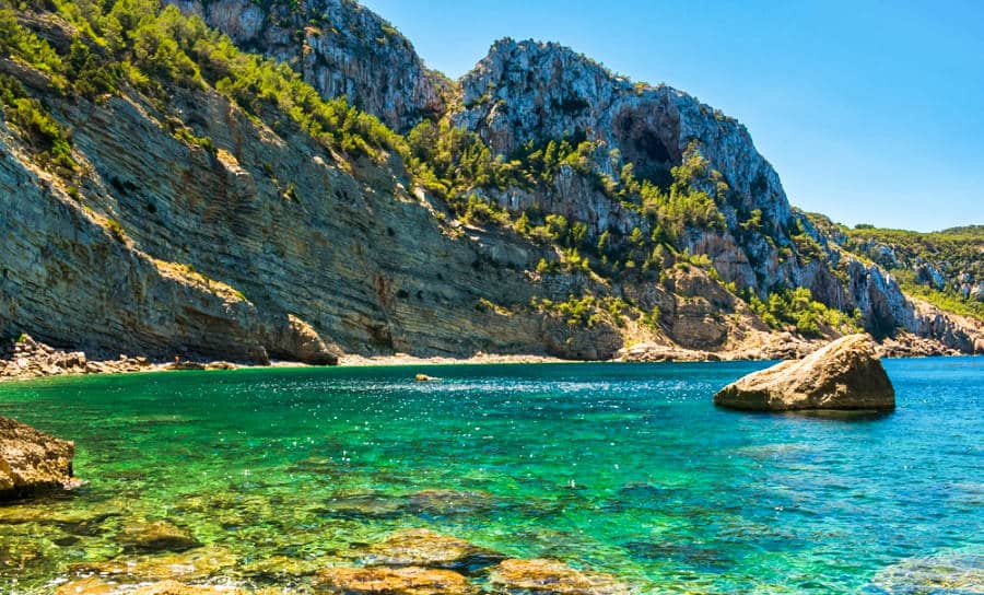 Panoramic view of the turquoise blue water and landscape of Mediterranean Balearic Island.