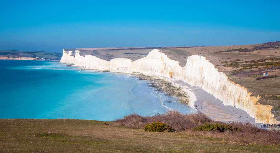 View of white cliffs and blue water from Seven Sisters