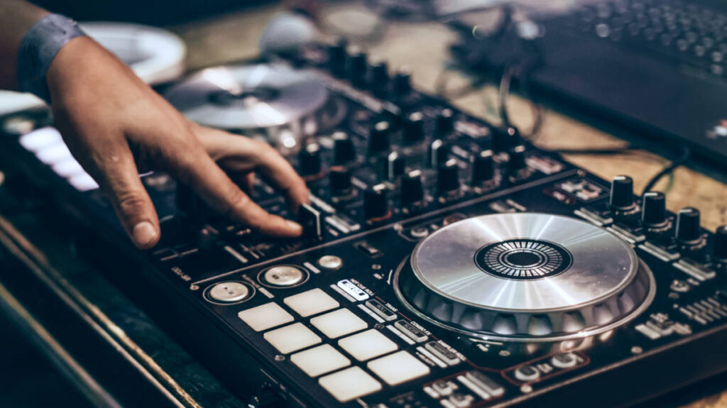 The DJ mixing tracks at the Shake Bar